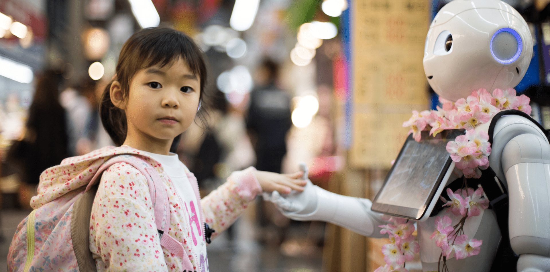 Girl shaking hands with Robot