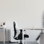 Person walking through a furnished office