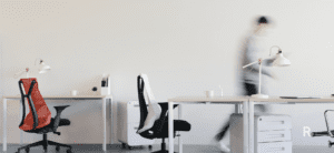 Person walking through a furnished office