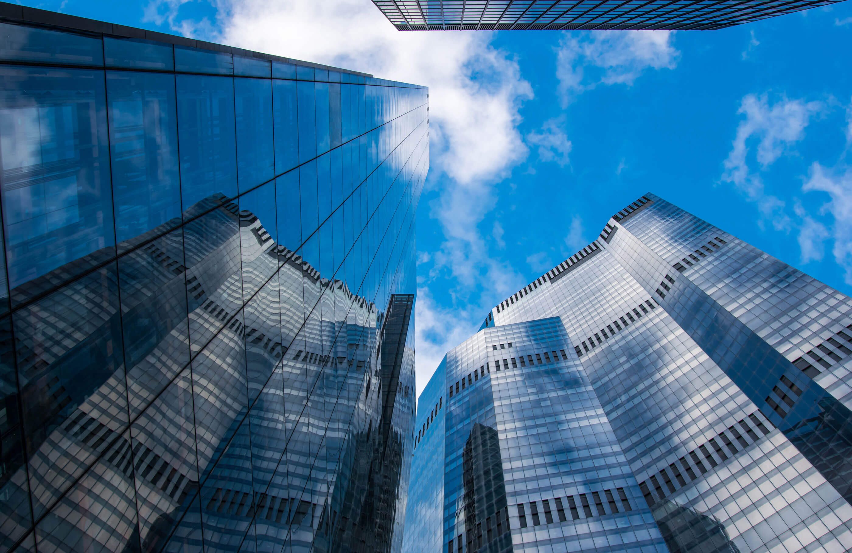 Skyscraper buildings with blue sky and clouds